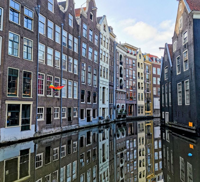 amsterdam houses in the red light district over a canal