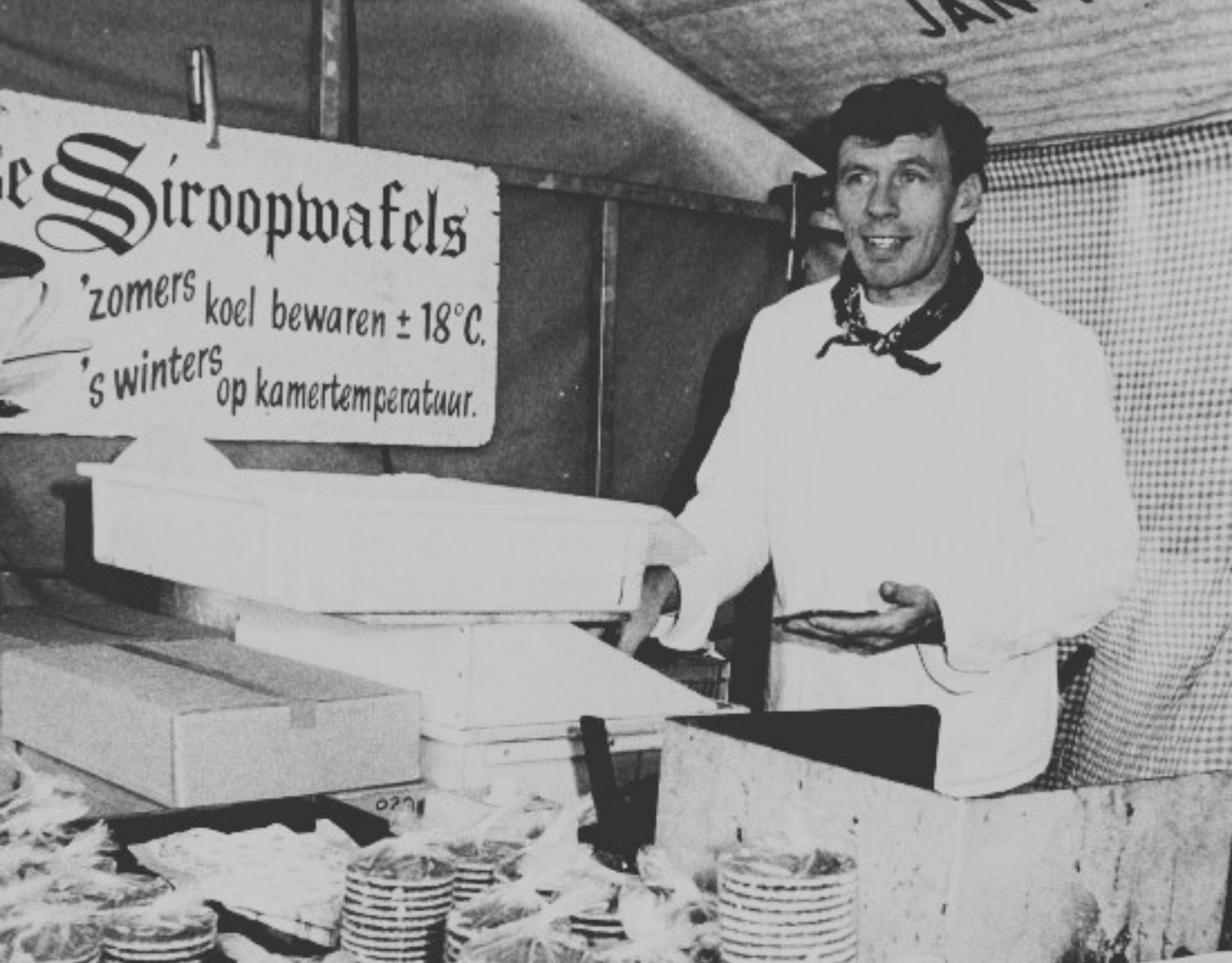 A Dutch stroopwafel maker selling his fresh stroopwafels at an Amsterdam market stand
