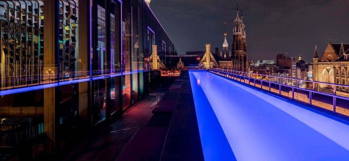 pool side and rooftop bar overlooking Dam Square Amsterdam at W Hotel Amsterdam